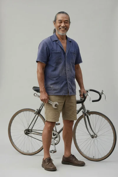 AI-generated Uncle Hock in the Bicycle Repair look.